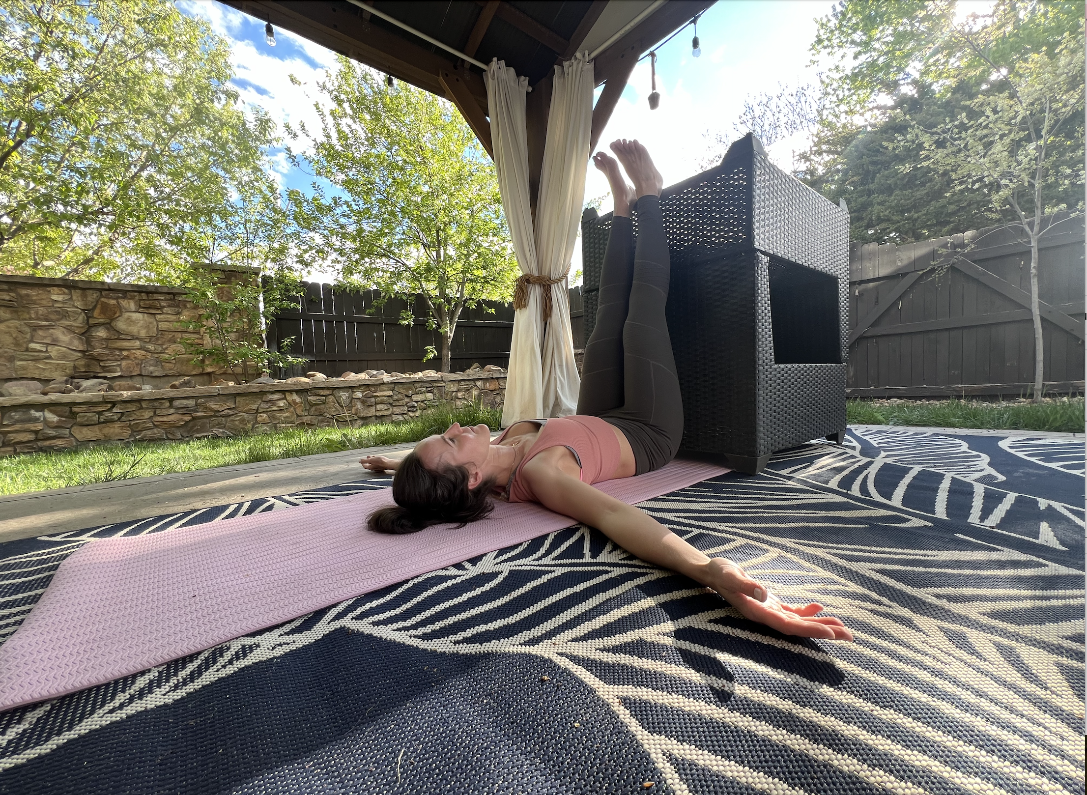 person doing legs up the wall pose